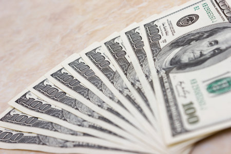 Bundle of dollars on the table close-up, one hundred dollars washington, one thousand - texture,...