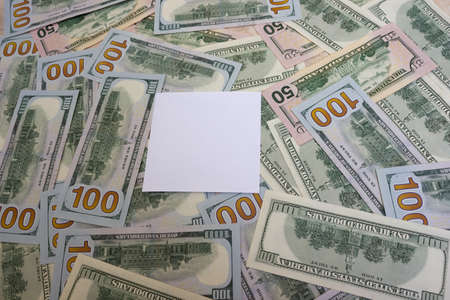 Paper for text on the background of dollars on the table close-up, one hundred dollars washington, one thousand - texture, backgroundの写真素材