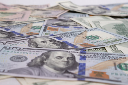 Bundle of dollars on the table close-up, one hundred dollars washington, one thousand - texture,...