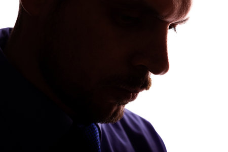 Sad man young unshaven businessman business clothes silhouette - on white background isolateの写真素材