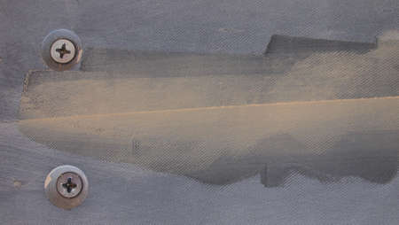 The process of filling with putty and glue the joints of the playing surface (bed table) of American billiards (American pool).の写真素材