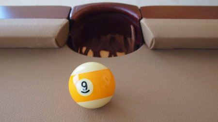Billiard ball (pool ball) on American billiards (American pool) while checking the playing surface...