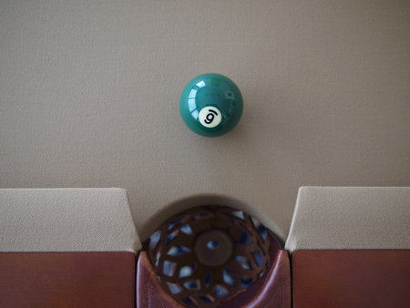 Billiard ball (pool ball) on American billiards (American pool) while checking the playing surface...