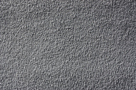 Synthetic textile material like Alcantara (Jet gray exclusive color) on a car door panel extreme...