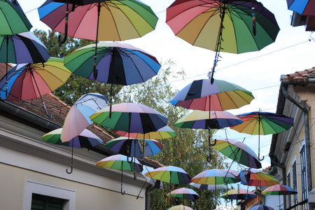 Elements of architecture of Szentendre with colorful umbrellas between houses, Hungary