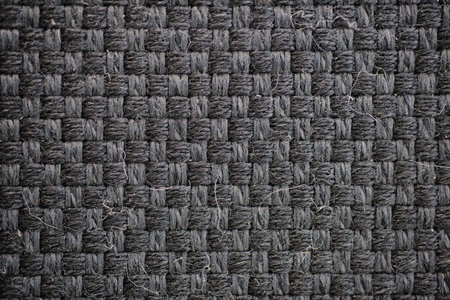 Black cloth car seat texture extreme close-up