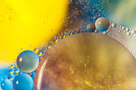 abstract colorful shapes over water surfaceの写真素材