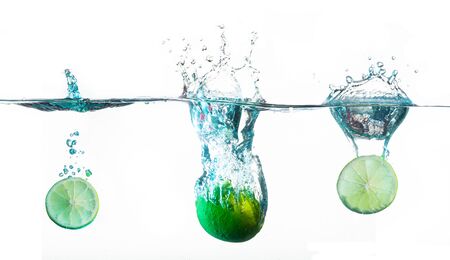 lime splashes on white backgroundの写真素材