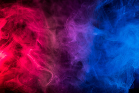 multicolor smoke on black backgroundの写真素材