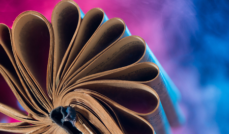 vintage book pages on colorful backgroundの写真素材