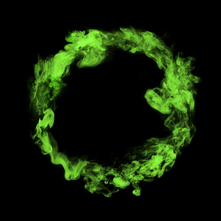 green colorful smoke circle isolated on black backgroundの写真素材