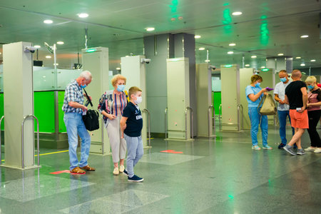 11.07.2020 - Kiev, Ukraine tourists in face masks after crossing borderline in international airport
