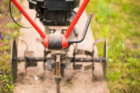 plowing mechanism ready to work on spring farmland soilの写真素材