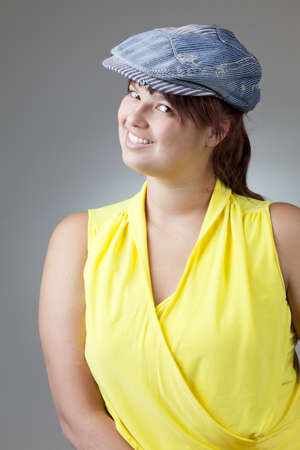 Girl in a denim capの写真素材