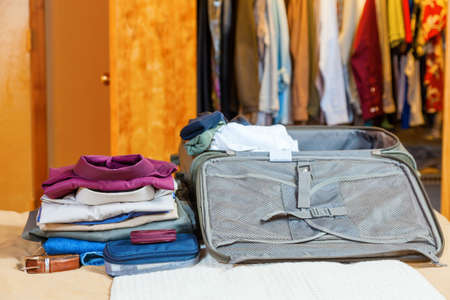 Open suitcase with clothesの写真素材