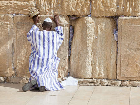 JERUSALEM - NOVEMBER 6 2012 - Jewish man prays at the Western Wall. The Western Wall a.k.a. the Wailing Wall is an important Jewish religious site located in the Old City of Jerusalem, Israel, November 6, 2012のeditorial素材