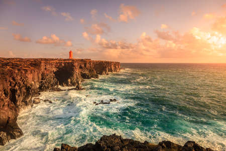 Western Icelandic coast and the lighthouse at Snaefellsnes Peninsulaの写真素材