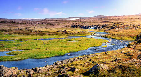High elevation plateau in Wesfjords, Iceland with a stream and small waterfallの写真素材