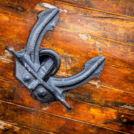 Closeup image of an anchor of a large sailing boat