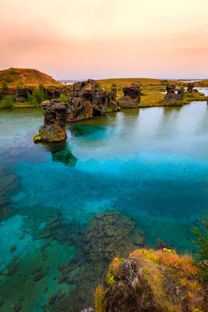 Volcanic rock formations in Lake Myvatn in Northern Icelandの写真素材