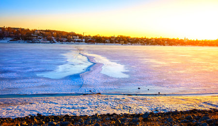 Frozen Volga River at sunset in the city of Kostroma, Russiaの写真素材