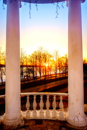 Sun setting over the Volga River in the city of Kostroma, Russiaの写真素材
