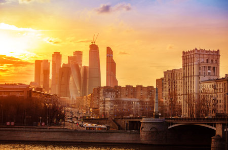 View to the modern complex of Moscow city from the Moscow River at sunsetの写真素材