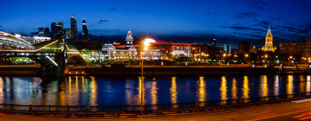 Nighttime panoramic view to Kiev Railway Station and modern Moscow City in Moscow, Russia