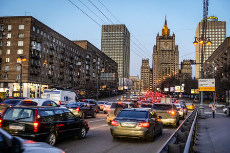 MOSCOW, RUSSIA - APRIL 4, 2015: Heavy evening traffic on Smolenskaya Street with the Ministry of Foreign Affairs building in the backdrop in Moscow, Russiaのeditorial素材