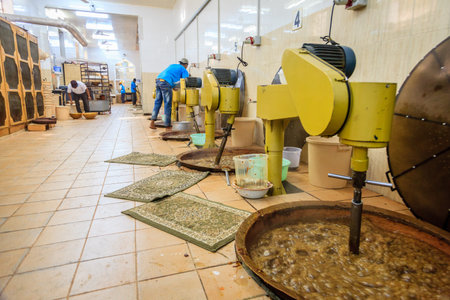 NIZWA, OMAN, MAY 27, 2016: production floor of Nizwa halwa factoryのeditorial素材