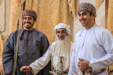 NIZWA, OMAN, MAY 27, 2016: Family portrait of Omani halwa makers at the factory in Nizwa, Omanのeditorial素材