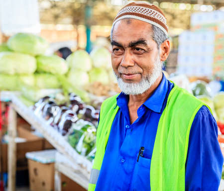 Dubai, June 4, 2016: portrait of local vendor at the fruit and vegetable market in Dubai, UAEのeditorial素材