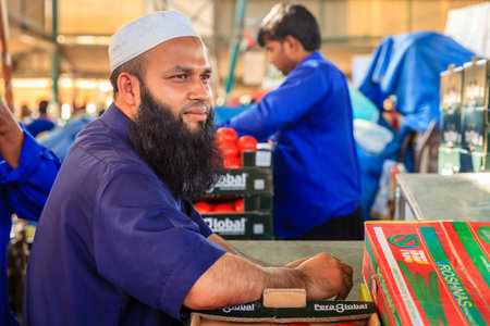 Dubai, June 4, 2016: portrait of local vendor at the fruit and vegetable market in Dubai, UAE