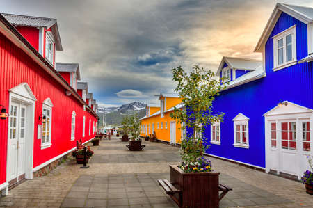 Colorful buildings with shops and restaurants in the village of Siglufjordur, Icelandのeditorial素材