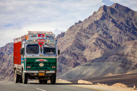 Kashmir, India - July 10, 2016: Traditionally decorated Tata truck on the road in Kashmir, Indiaのeditorial素材