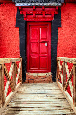 Bridge and a door in a Buddhist monastery in Ladakh, Kashmir, Indiaの写真素材