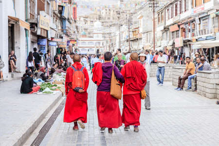 Leh, Ladakh, India, July 12, 2016: three Buddhist monks walking on the main shopping street in Leh, Ladakh district of Kashmir, Indiaのeditorial素材