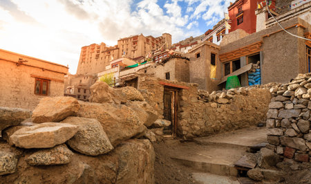A street in residential area of Leh, Ladakh district of Kashmir, India with Leh Palace in the backdropのeditorial素材