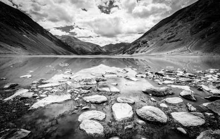Small lake in highlands of Ladakh region of Kashmir, India. Black and white.の写真素材