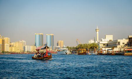 Dubai, UAE, October 7, 2015: Abra is making its way across Dubai Creek ferrying tourists and locals for only 1 dirham per personのeditorial素材
