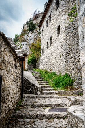 Medieval cobblestone street in a small Bosnian town of Pociteljの写真素材