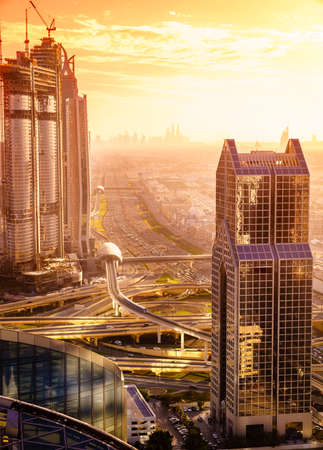 Bird's eye view of Dubai skyline and rush hour traffic in downtownの写真素材