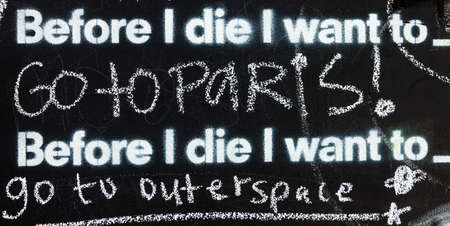 Fragment of a blackboard reading: Before I die I want to go to Parisの写真素材