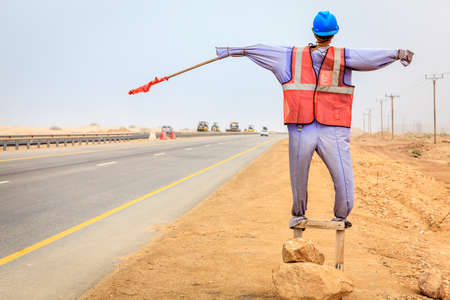 Manequin of a worker used at road construction sites in Omanの写真素材