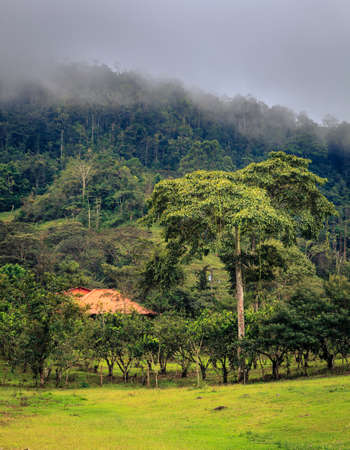 Farm house at the foot of a hill in central Costa Ricaの写真素材