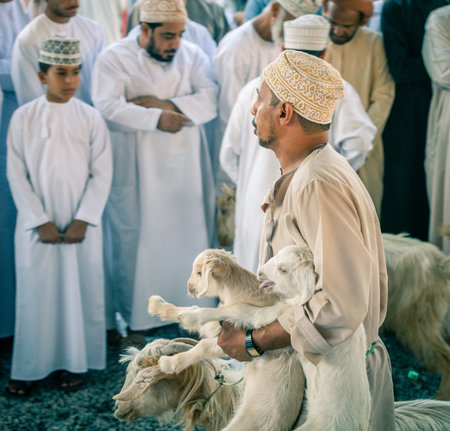 Nizwa, Oman, December 2, 2016: Goat sellers at the Friday goat market in Nizwa, Omanのeditorial素材