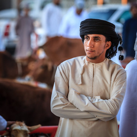 Nizwa, Oman, December 2, 2016: Portrait of a local farmer at the Friday goat market in Nizwa, Omanのeditorial素材