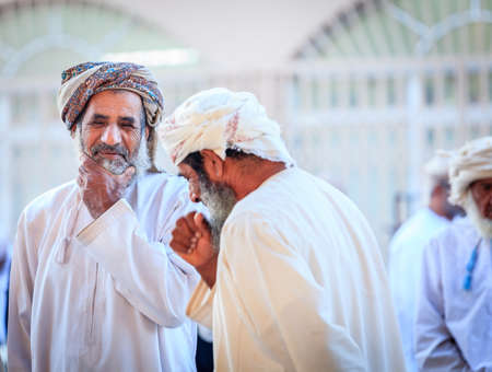 Nizwa, Oman, December 2, 2016: Local men shopping at the Friday goat market in Nizwa, Omanのeditorial素材