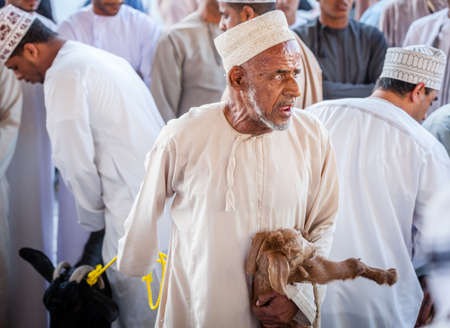Nizwa, Oman, December 2, 2016: Goat sellers at the Friday goat market in Nizwa, Omanのeditorial素材