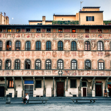 Crescent moon is rising over an old building with frescos on the Piazza di Santa Croce in Florence, Italyのeditorial素材